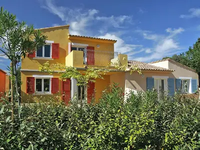 a large swimming pool with the ocean in the background at Apartment in Corsica with Beach Access in Borgo