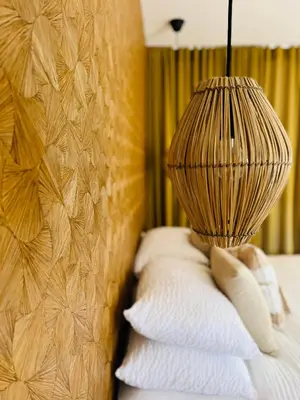 a room with a bed with a lamp on it at Aria Cigala in Bonifacio