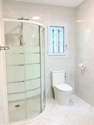 a bathroom with a shower and a toilet at Campo Vecchio Kamerops et piscine in Ghisonaccia