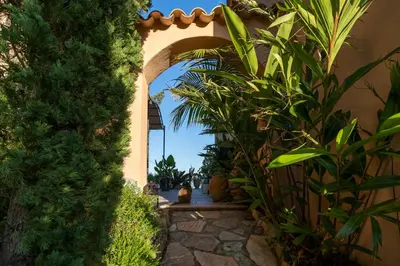 an archway in a building with plants at Casa del Sole Chambres d'Hotes de Charme in Favone