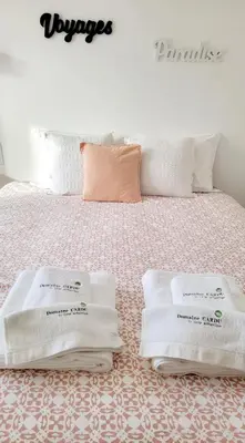 a bed with white towels sitting on top of it at DOMAINE CARDU in Cardo-Torgia