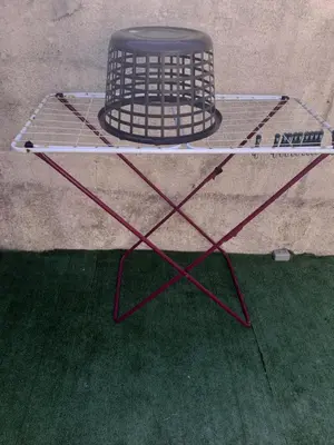 a metal table with a hat on top of it at Maison à 200m de la mer, 10 mn de l'aéroport de Bastia et a 20mn du port in Lucciana