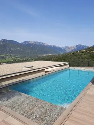 a swimming pool in front of a house at Villa Cupabia vue mer in Viggianello