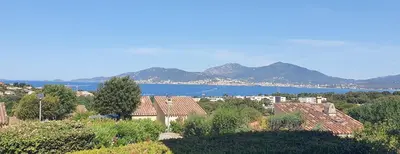 a large blue swimming pool with people standing around it at Beautiful 40 M2 With Pool Near The Beach! in Grosseto-Prugna