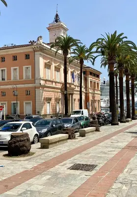 a street with cars parked in front of a building at Superbe appartement T2 en plein centre d'Ajaccio, rue Fesch in Ajaccio