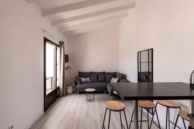 a living room with a couch and a table at Le Paesolu in Grosseto-Prugna