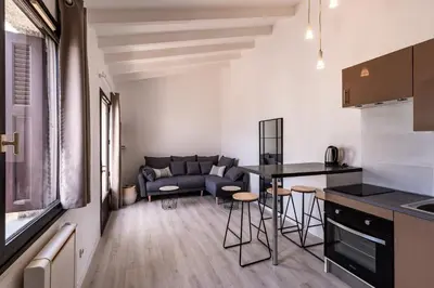 a living room with a couch and a table at Le Paesolu in Grosseto-Prugna