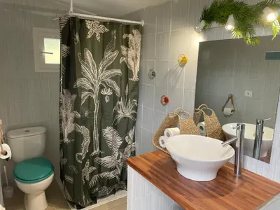 a bathroom with a sink and a shower curtain at FORCONE in Cauro