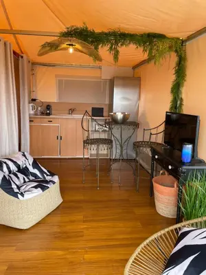 a room with a kitchen and a table in a tent at FORCONE in Cauro