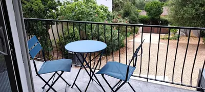 two chairs and two chairs in a dirt yard at Edith et Jean-Paul in Porto-Vecchio