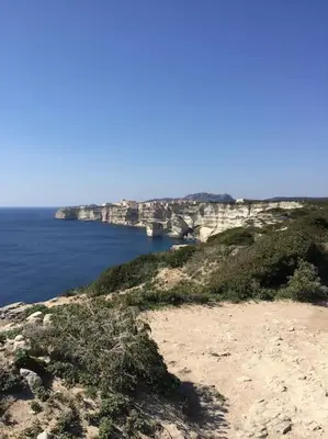 a large body of water with a bridge in the background at Appartement duplex plein sud sur le port de Bonifacio in Bonifacio