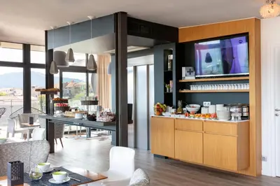 a kitchen with a counter with food on it at Hotel Alcyon in Porto-Vecchio