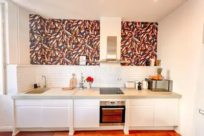 a kitchen with a sink and a counter top at Alba - Central Glimpse of the sea Sea nearby in Ajaccio