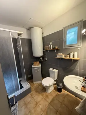 a bathroom with a toilet and a sink at Maison T3 Bastia Sud, Casamozza in Monte