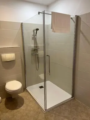 a shower stall with a toilet in a bathroom at Les Jardins De Santa Giulia - Charmante chambre dhte in Porto-Vecchio