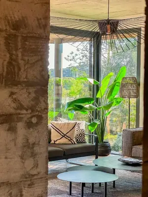 a living room with a couch and a table at Villa Santa Lucia Di Fautea in Sainte-Lucie de Porto-Vecchio