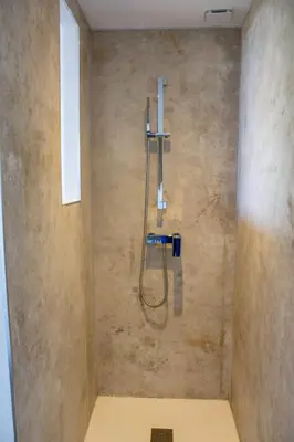 a shower in a bathroom with a shower head at Villa Santa Lucia Di Fautea in Sainte-Lucie de Porto-Vecchio