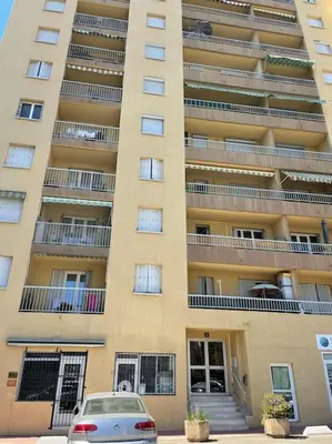 a building with a car parked in front of it at Le Pélican T2 Magnifique in Ajaccio