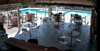 a picture of a pool with a table and an umbrella at TRA MANNA in Lecci