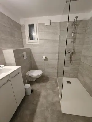 a bathroom with a shower and a toilet and a sink at TRA MANNA in Lecci