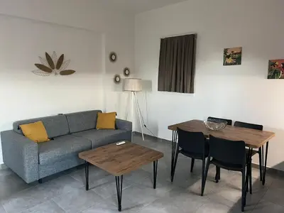 a living room with a couch and a table at TRA MANNA in Lecci