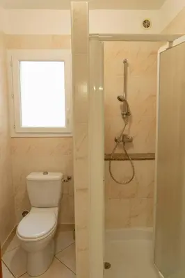 a bathroom with a toilet and a shower at Residence Scopa Marina in Poggio-Mezzana
