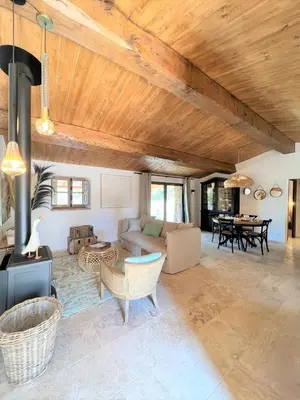 a living room with a couch and a table at Casetta Tinuta in Sainte-Lucie de Porto-Vecchio
