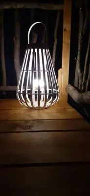 a light that is sitting on top of a table at LES CABANES DE LUTINA in Poggio-Marinaccio