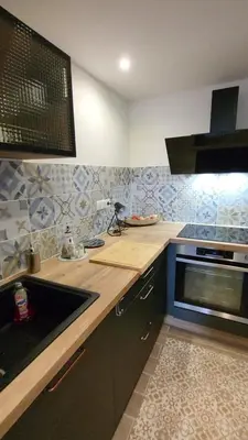 a kitchen with a sink and a stove at Superbe T2 avec balcons, Vieux Port, Hyper centre Ajaccio in Ajaccio