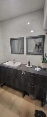 a bathroom with a sink and a mirror at Superbe T2 avec balcons, Vieux Port, Hyper centre Ajaccio in Ajaccio