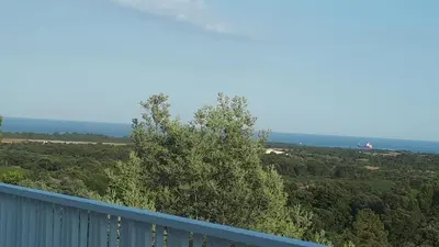 a view from the balcony of a house at JOLIE VILLA dans un endroit paisible, à 3 mn de la Mer et de la Montagne in Ventiseri