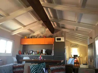 a living room with a couch and a table at Small luxury loft, down Town Petit Loft (attique) in Ajaccio