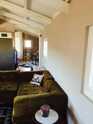 a living room with a couch and a table at Small luxury loft, down Town Petit Loft (attique) in Ajaccio