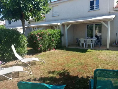 a group of chairs and tables in a yard at Villa climatisée A Nuciola Prunete Entre mer, montagne et piscine in Cervione