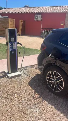 a car is hooked up to a gas pump at Joli T2 climatisé au calme à 10 mm de Porto-Vecchio dans une résidence de tourisme in Lecci