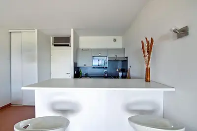 a kitchen with two white toilets in a room at Studio Rossi - Ajaccio - Welkeys in Ajaccio