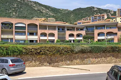 a car parked in front of a large building at Studio Rossi - Ajaccio - Welkeys in Ajaccio
