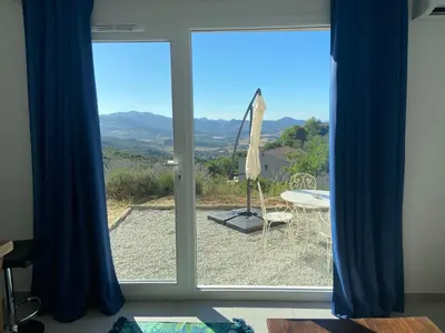 a sliding glass door with a view of a patio at Gîte à la ferme chez Félix et Marie-Ca in Vallecalle