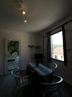 a living room with a sink and a window at Petit appartement à proximité de St Florent in Vallecalle