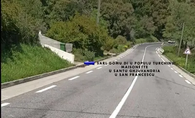 a road with a sign on the side of it at U San Francescu Maisonette Modulaire Type studio in Volpajola