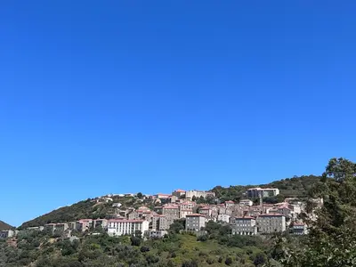 a town on a hill with houses on it at Chez Caro in Sartène