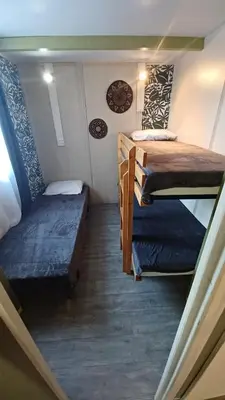 a small room with two bunk beds in it at Le petit chalet d' Anto-Francè in Levie