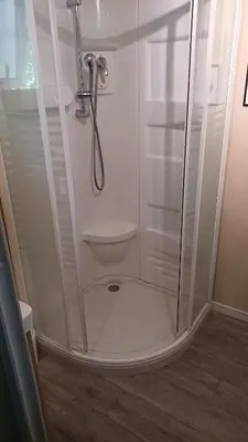 a shower with a glass door in a bathroom at Le petit chalet d' Anto-Francè in Levie