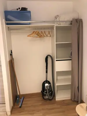 a vacuum cleaner is sitting in a closet at Villa Jade in Sartène