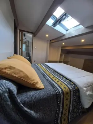 a large bed in a room with a window at afa butrone sarrola in Afa