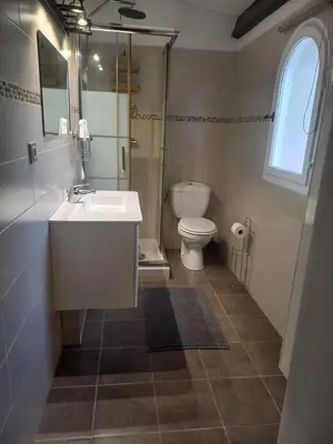a bathroom with a sink and a toilet at afa butrone sarrola in Afa