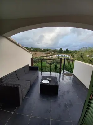 a living room with a couch and a table at afa butrone sarrola in Afa