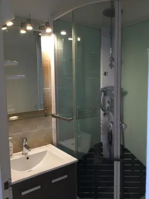 a bathroom with a sink and a shower at Maison au calme avec terrain et vue sur la mer in Poggio-Mezzana