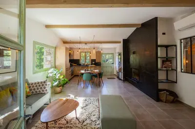 a living room with a table and a dining room at Domaine Pardini in Porto-Vecchio