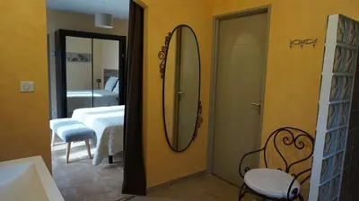 a bathroom with a mirror and a bedroom with a bed at VILLA 4pers, STUNNING SEA VIEW, BEACH ON FOOT 4* in Olmeto